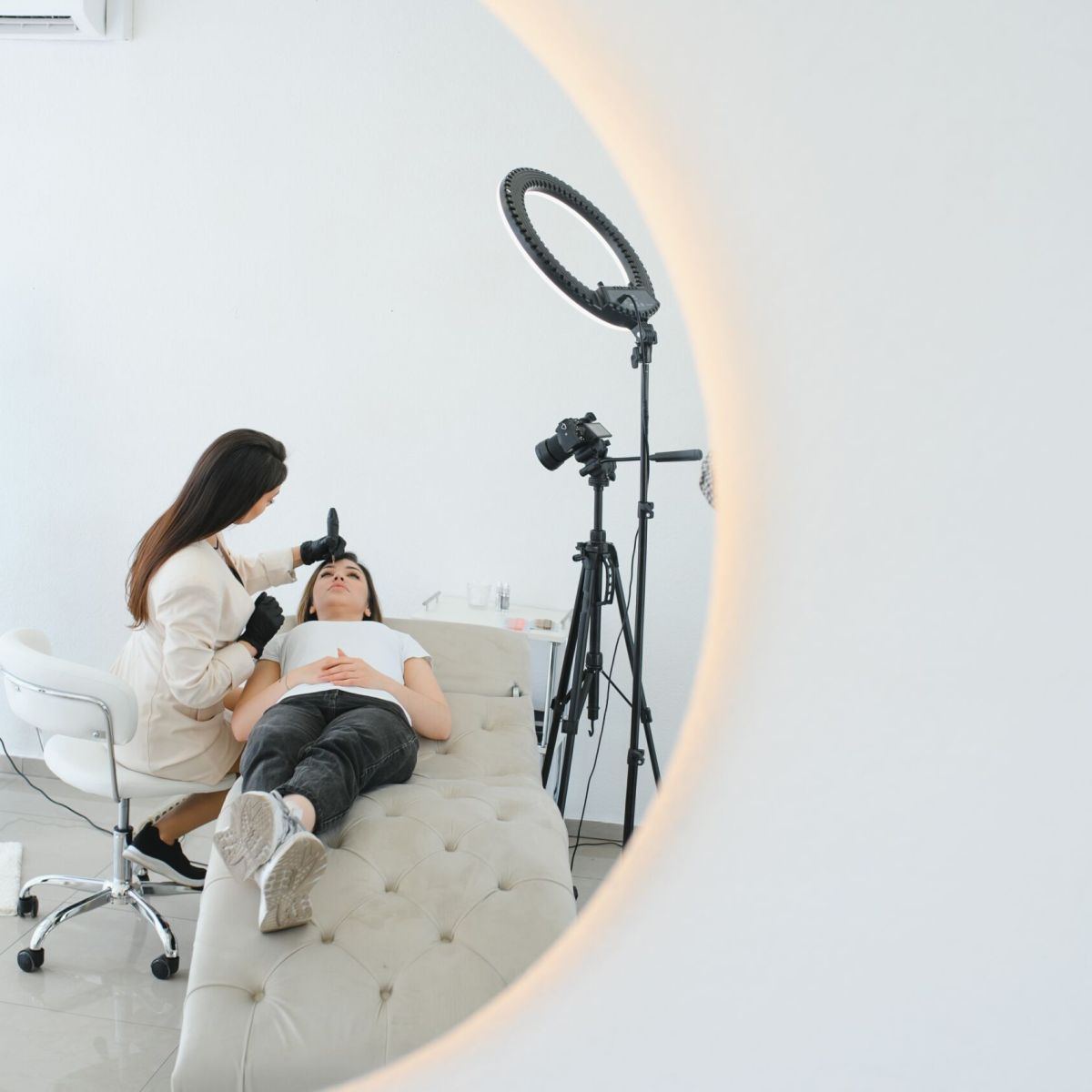 Permanent make up procedure. Lip makeup in tattoo salon.