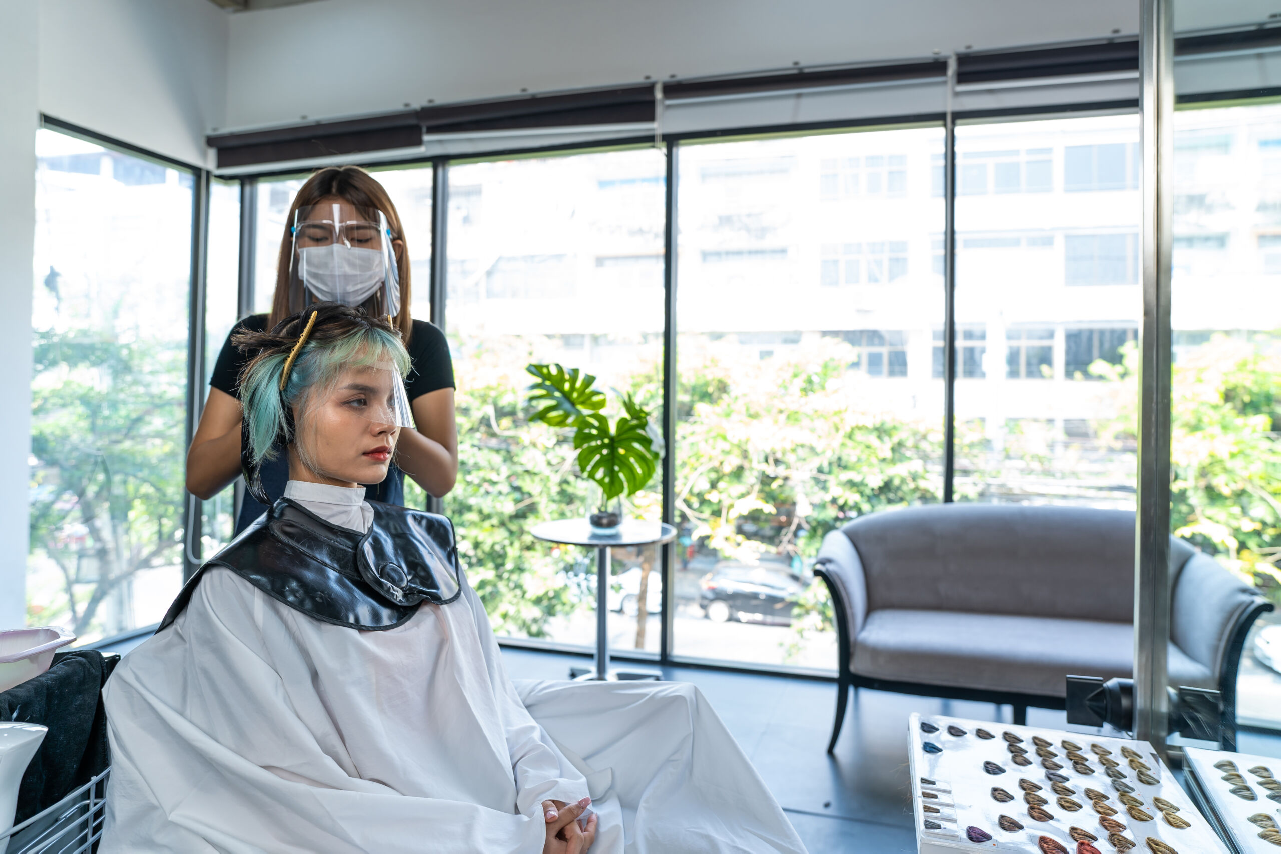 professional-woman-hairstylist-dyeing-young-woman-2025-03-25-21-25-32-utc